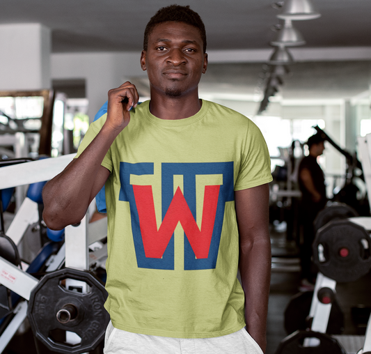 A man in a gym wearing a light yellow-green t-shirt with a large blue and red 'W' graphic on the front, paired with white shorts.