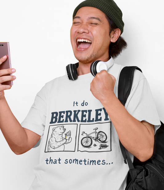 A man wearing a white graphic t-shirt with a black print that reads 'It do BERKELEY that sometimes.