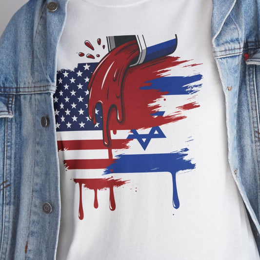 A person wearing a white graphic T-shirt under an open light-wash denim jacket, paired with blue jeans. The T-shirt features a red, white, and blue graphic combining the American flag, a Star of David, and dripping paint effects.